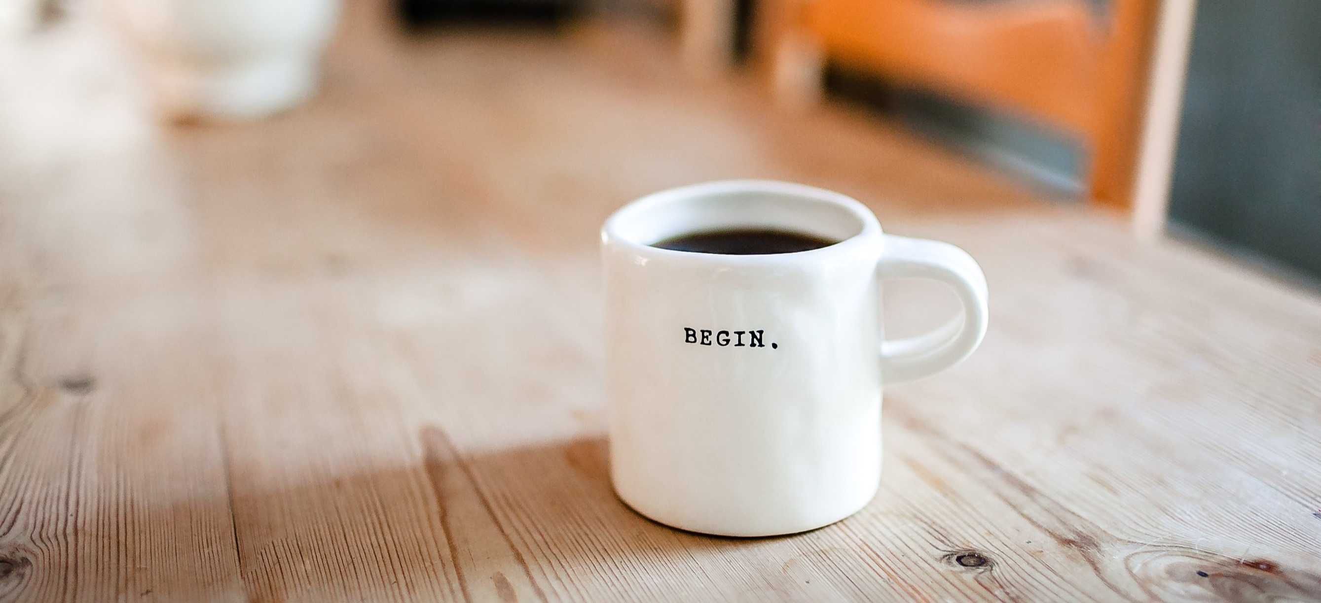 Kaffeetasse mit der Aufschrift BEGIN